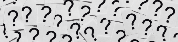 Sheets of paper with question marks.
